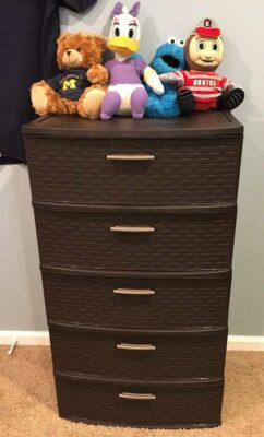 Brown wicker-looking plastic drawers. 5 drawers with stuffed animals on top