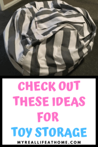 gray and white striped toy storage bag, similar to bean bag chair