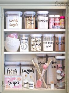 clear containers in pantry with labels