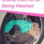 washing machine with clothes inside and labeled remove grease stains even after being washed