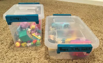 2 small clear plastic storage containers with small toys inside - Puppy In My Pocket and Shopkins